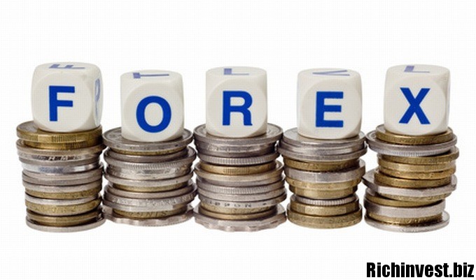 Stacks of coins with the word FOREX isolated on white background